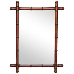 French 1920s Brown Faux-Bamboo Walnut Mirror with Intersecting Corners