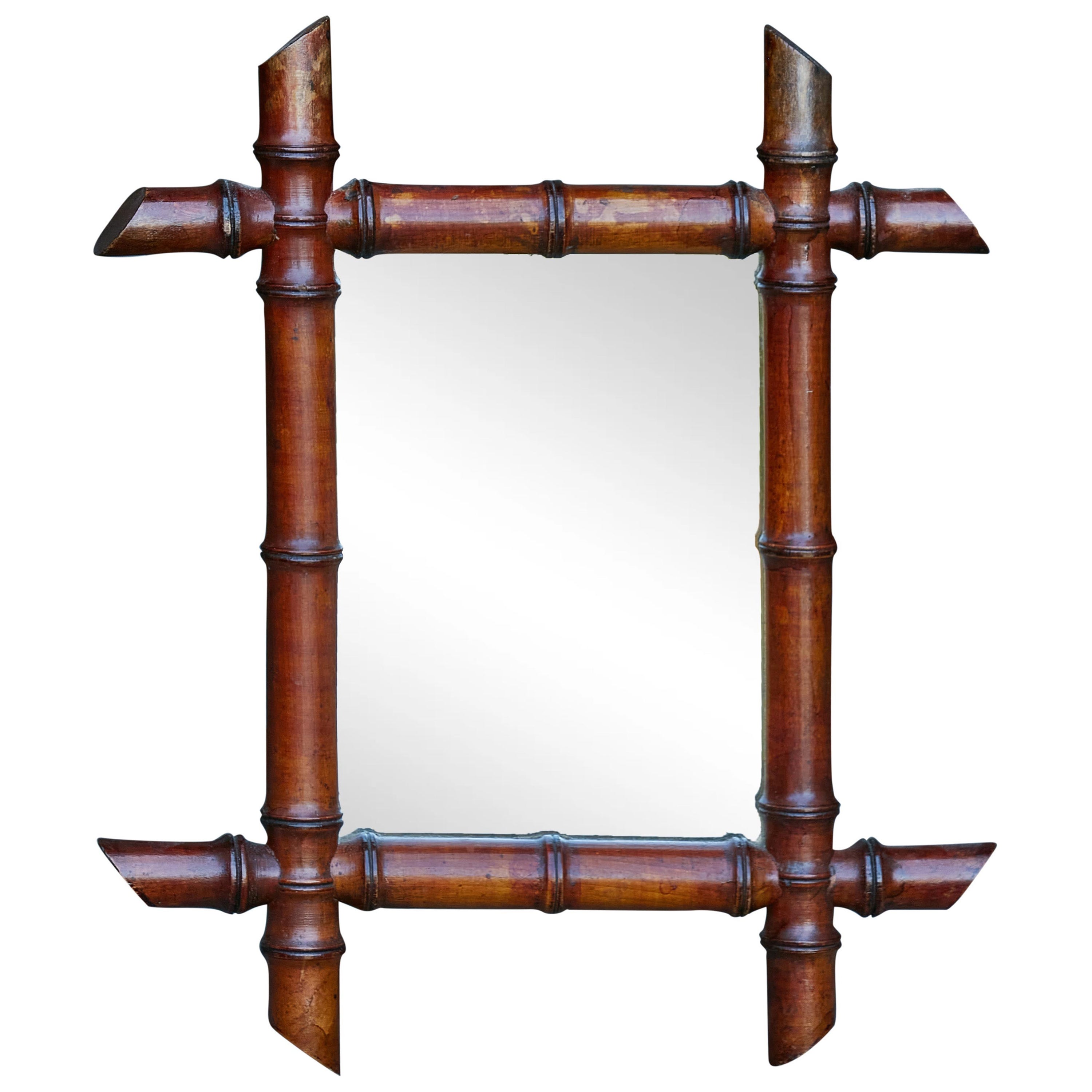 Petite French Faux Bamboo Walnut Mirror circa 1920 with Slanted Accents For Sale