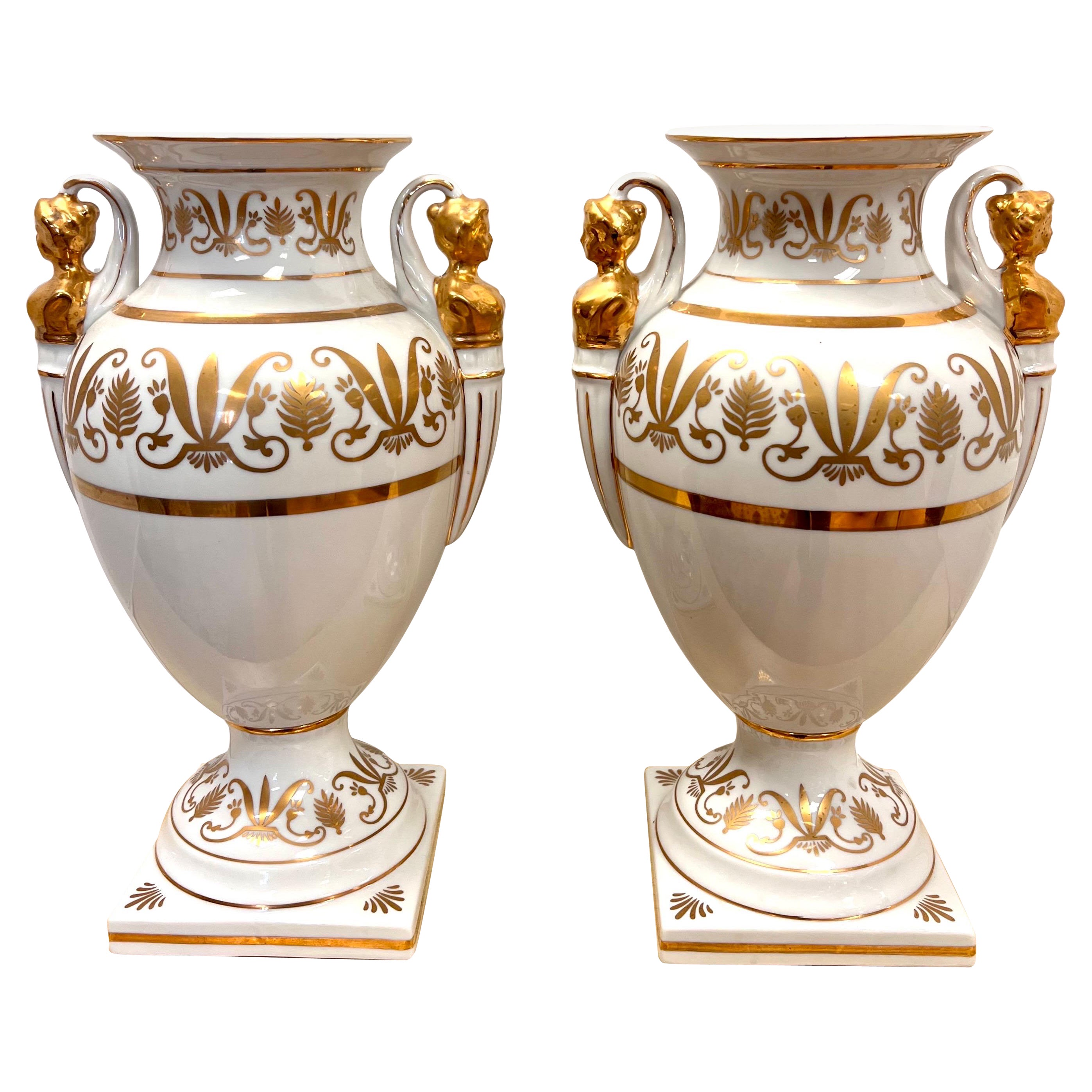 Pair of Neoclassical Campana Porcelain Gold and White Female Figural Urns