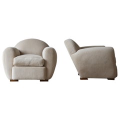 Superbe paire de fauteuils club ronds inclinables, tapissés en alpaga pure