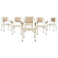 Ensemble de six chaises de jardin à tête de lion en bronze d'après Giacometti