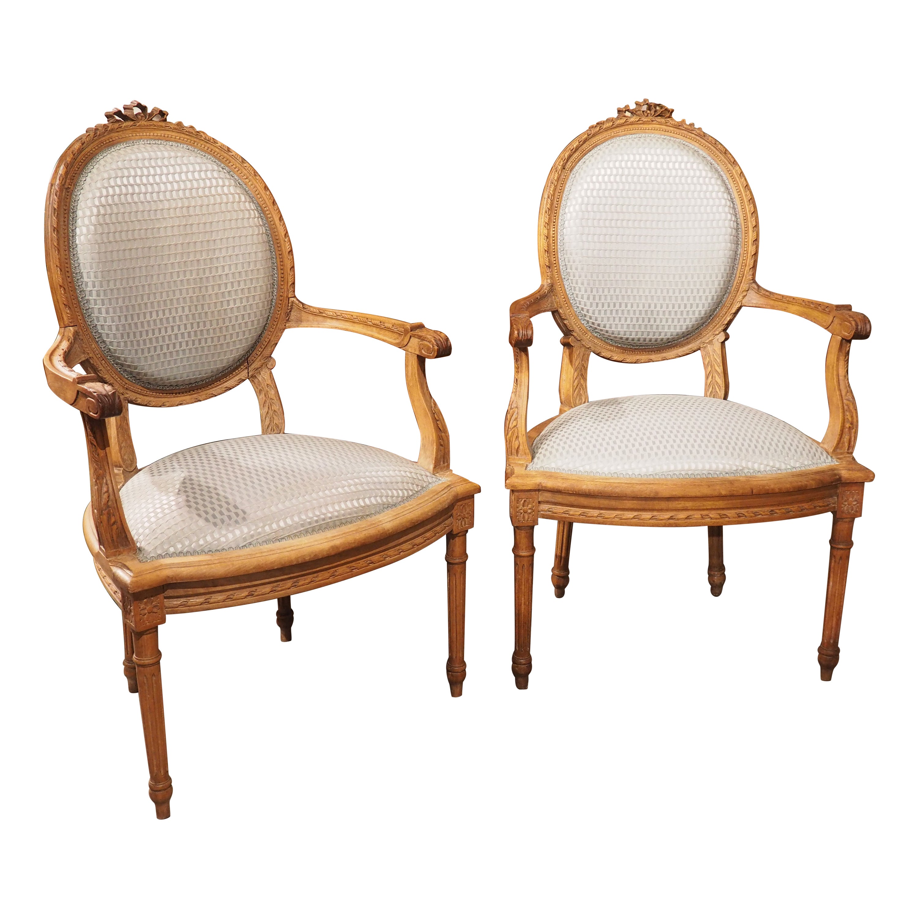 Pair of French Louis XVI Style Beechwood and Blue Silk Cabriolet Armchairs For Sale