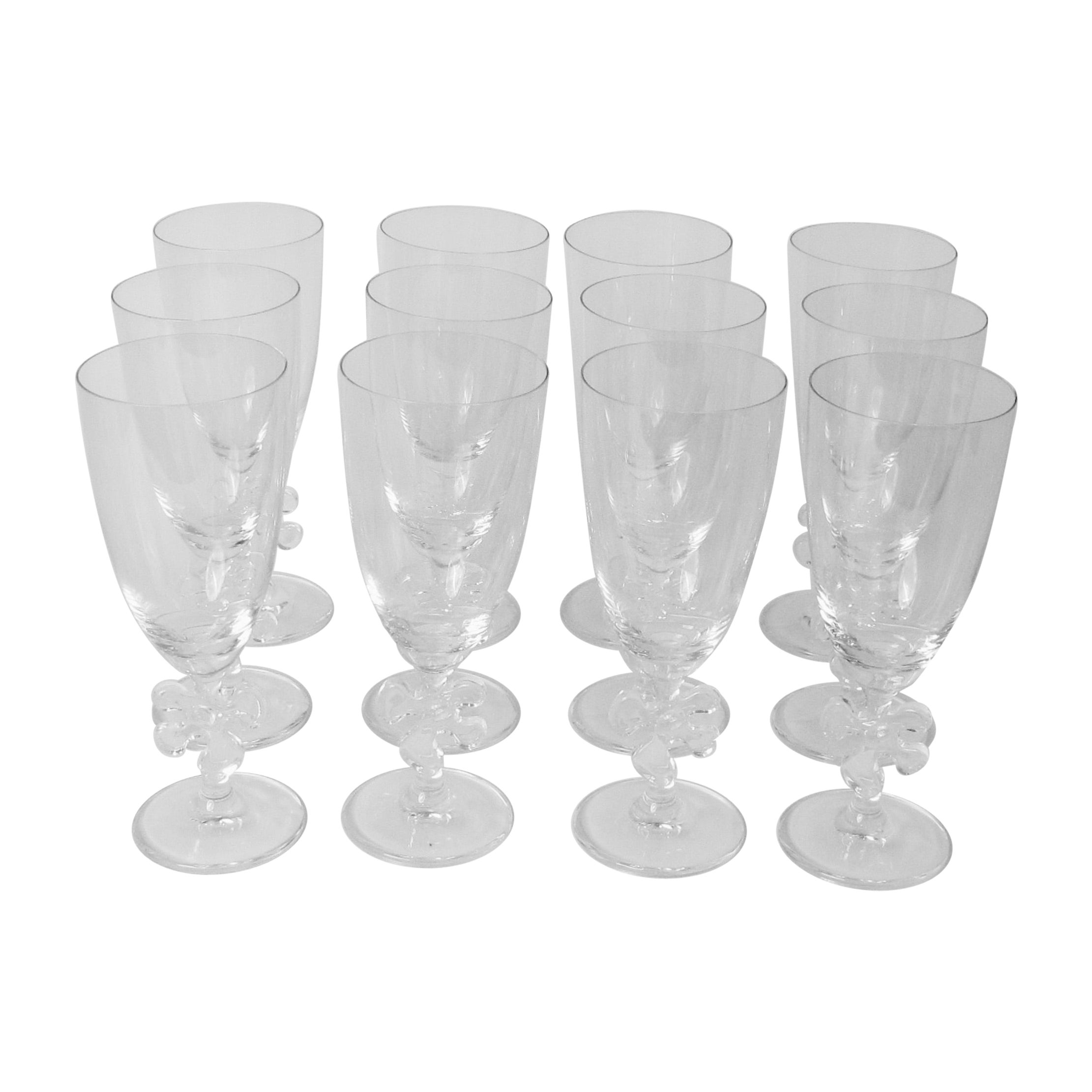 Set of twelve fun and elegant Marc Aurel water glasses with jigsaw stem