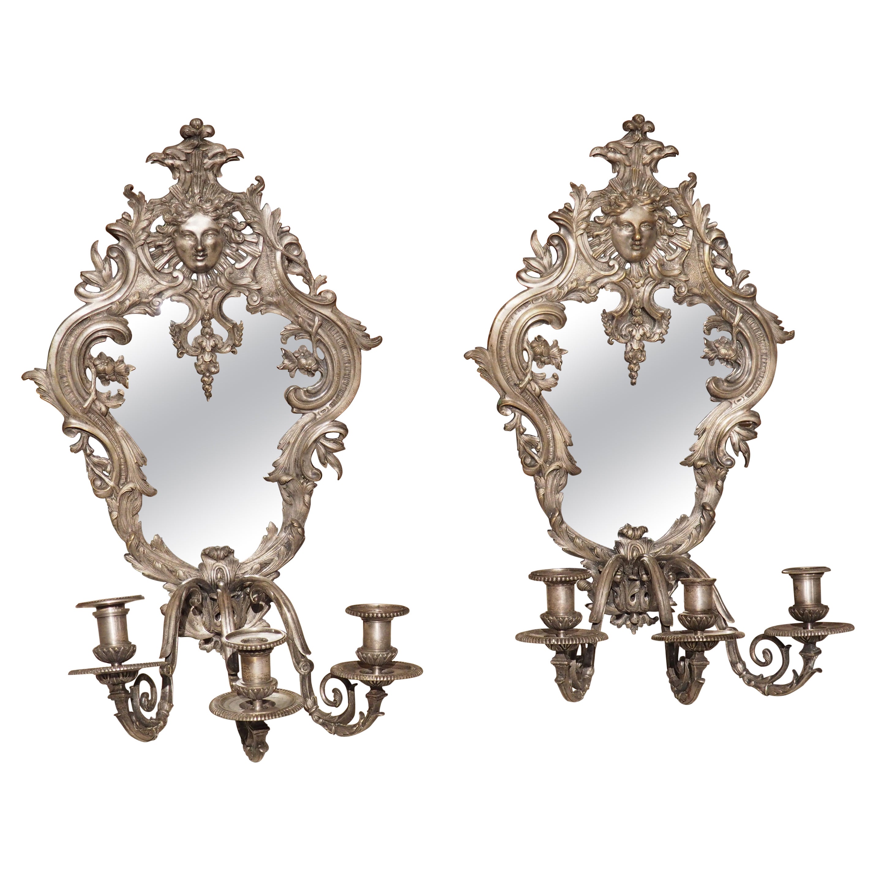 Pair of circa 1850 Régence Style Silvered Bronze Mirrored Sconces from France