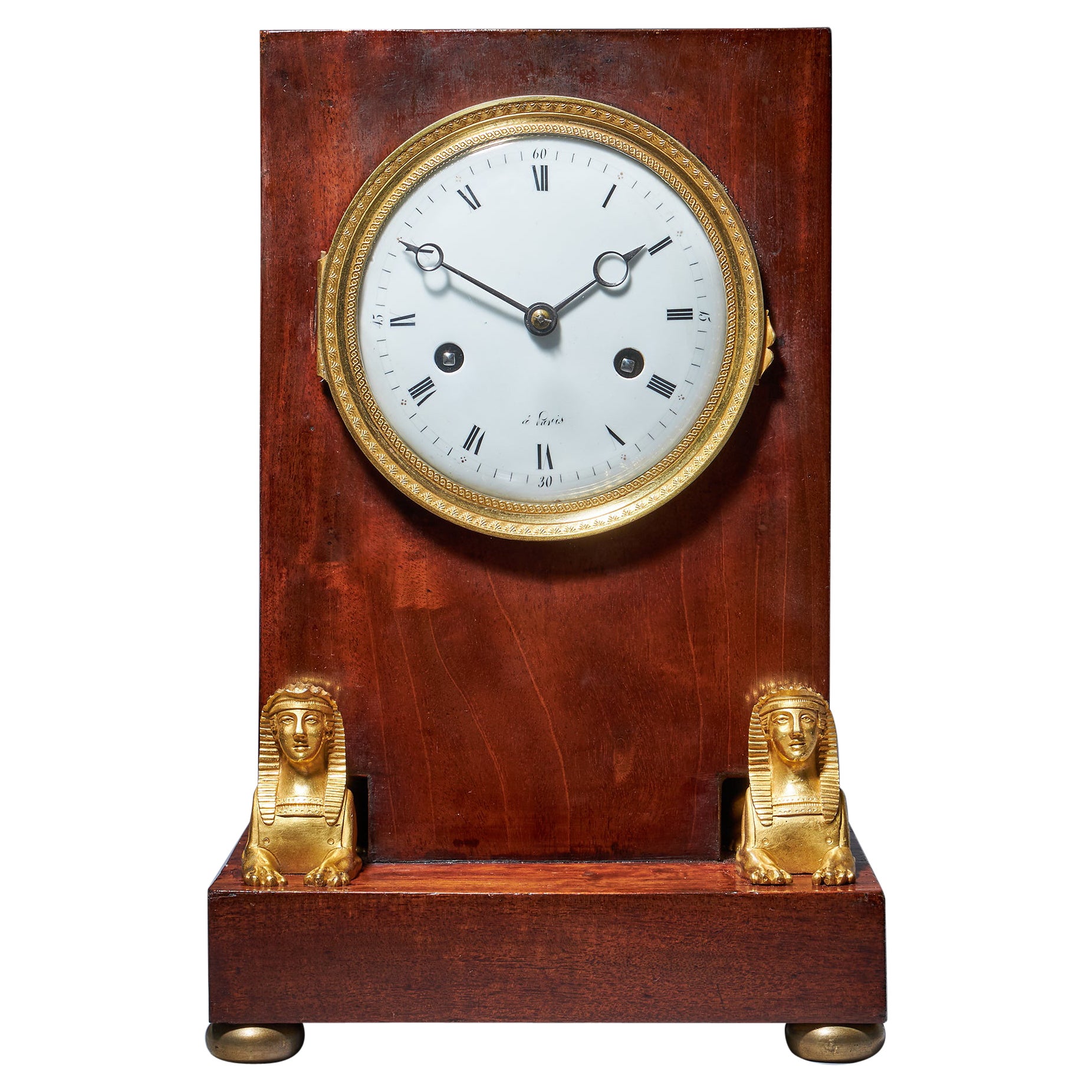 Horloge de cheminée du 19e siècle en acajou flammé d'époque Napoléon Empire