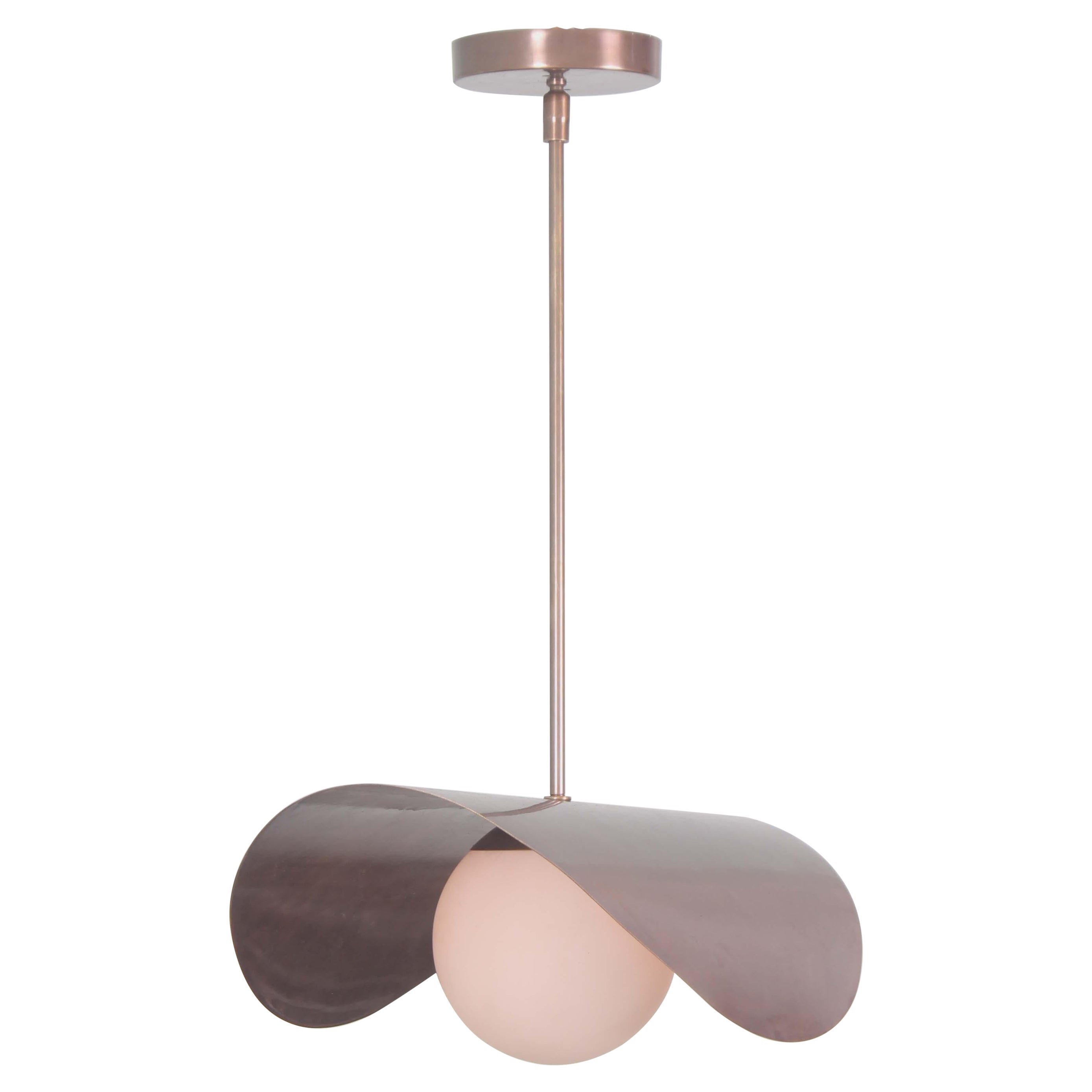 Brass saddle shaped pendant with satin glass globe. 

Actual drop stem is 24 in. Please specified desired lenght.

Contain one E26 socket rated at 60 watt . 

Brass finish available are raw , polished , brushed , blackened , antique , matte black 