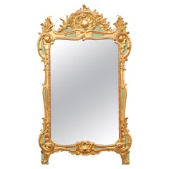 Miroir de style rococo français sculpté et doré, début du 20e siècle