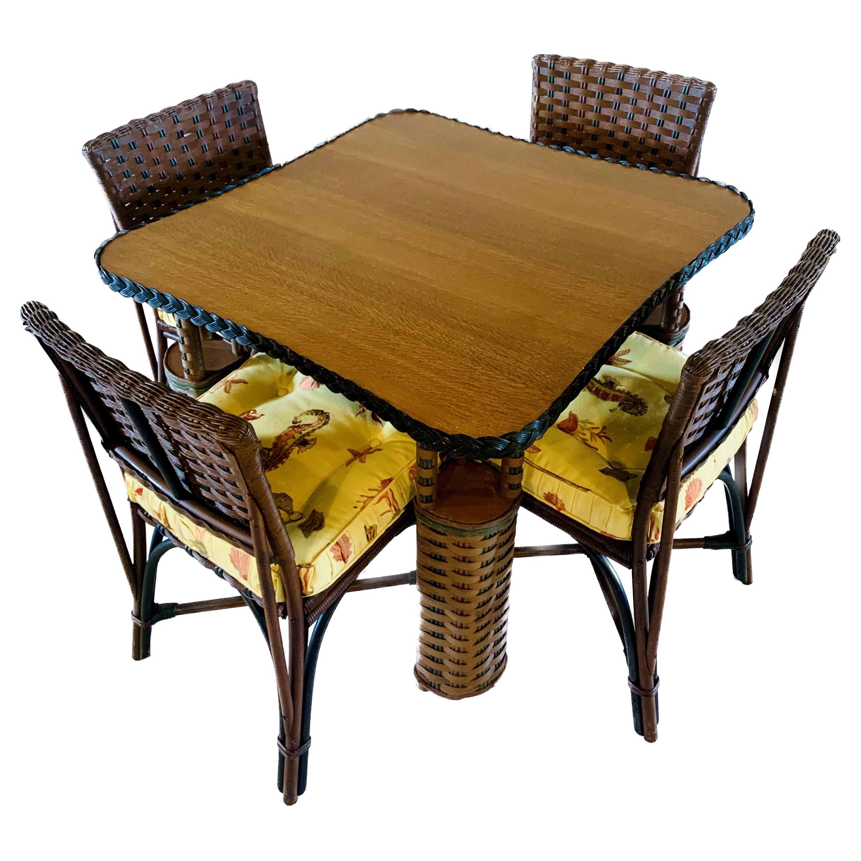 A very rare matching and unique card / game table with four matching chairs.The five piece matching set consists of a natural finished quarter sawn oak topped game table and four matching chairs. The table and chair bodies are done in a beautiful