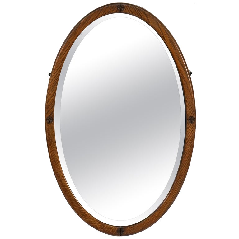 English Oval Parlour Mirror with Beveled Glass and Oak Frame For Sale