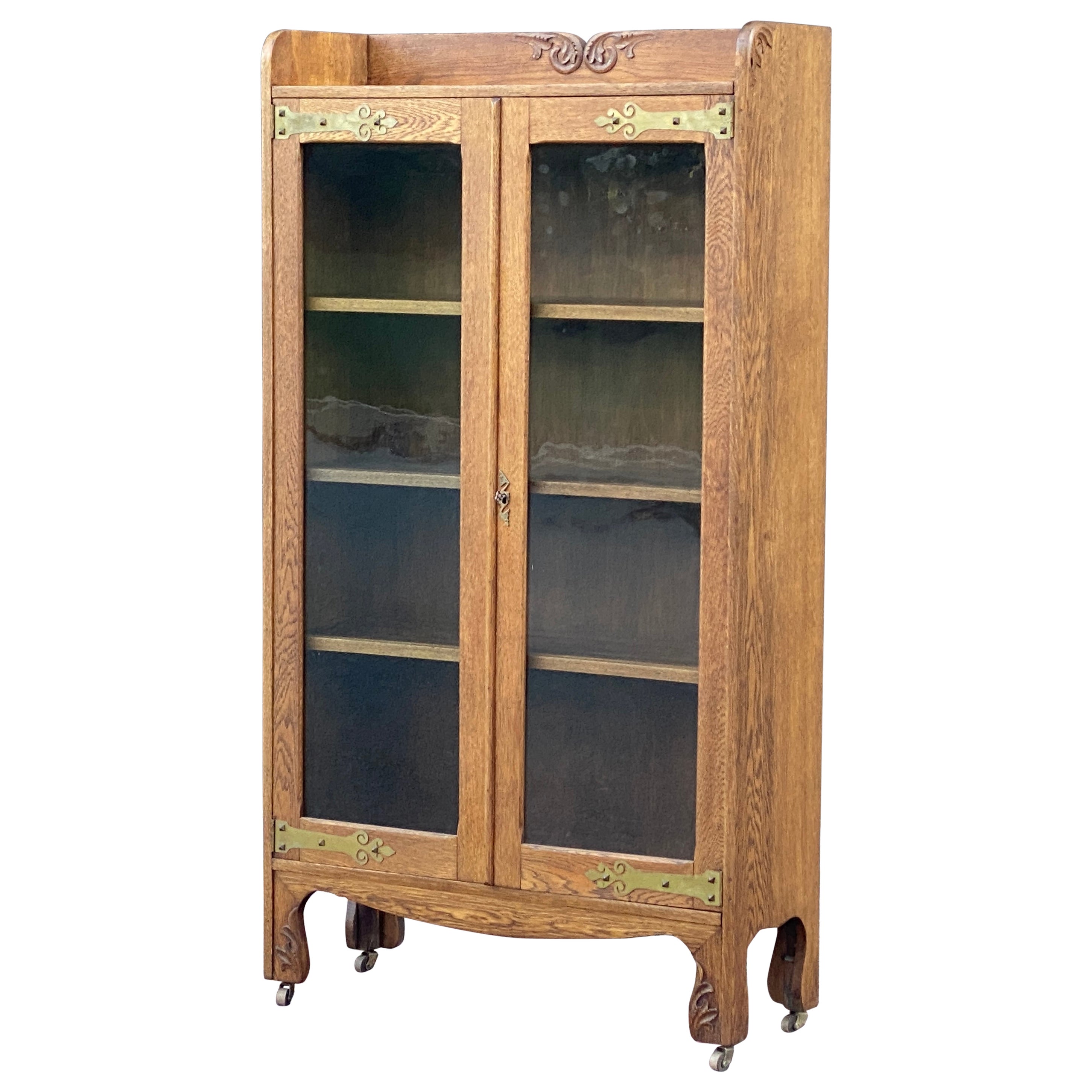 Antique Carved Oak Glass Door Locking Bookcase with Decorative Brass For Sale