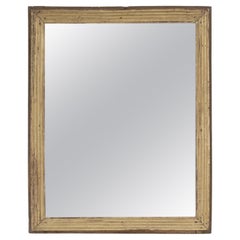 Miroir en bois doré à cannelures