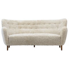 Danish modern sofa with sheep skin in the manner of Finn Juhl