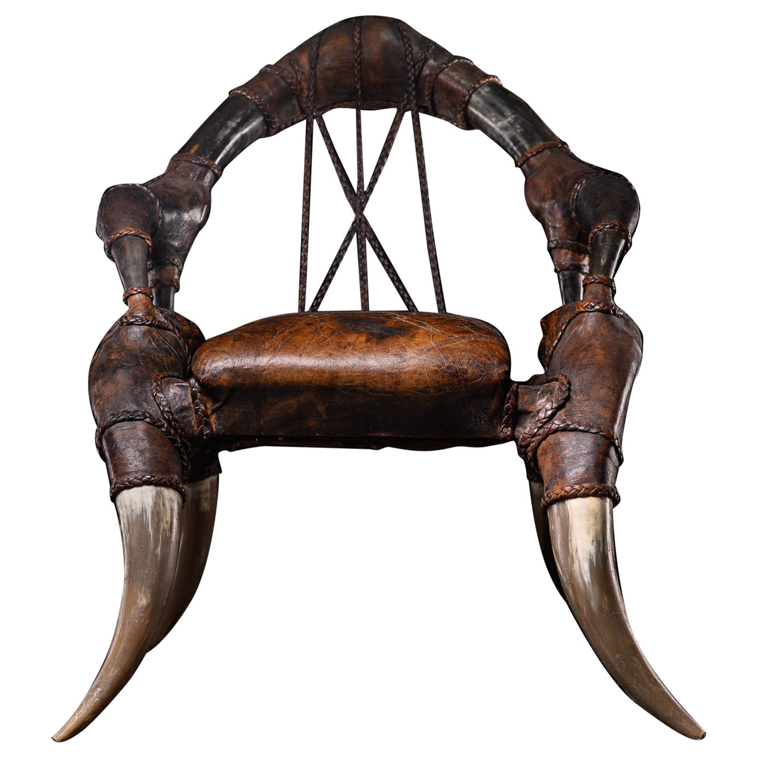 Rare fauteuil colonial ancien en cuir africain et en corne