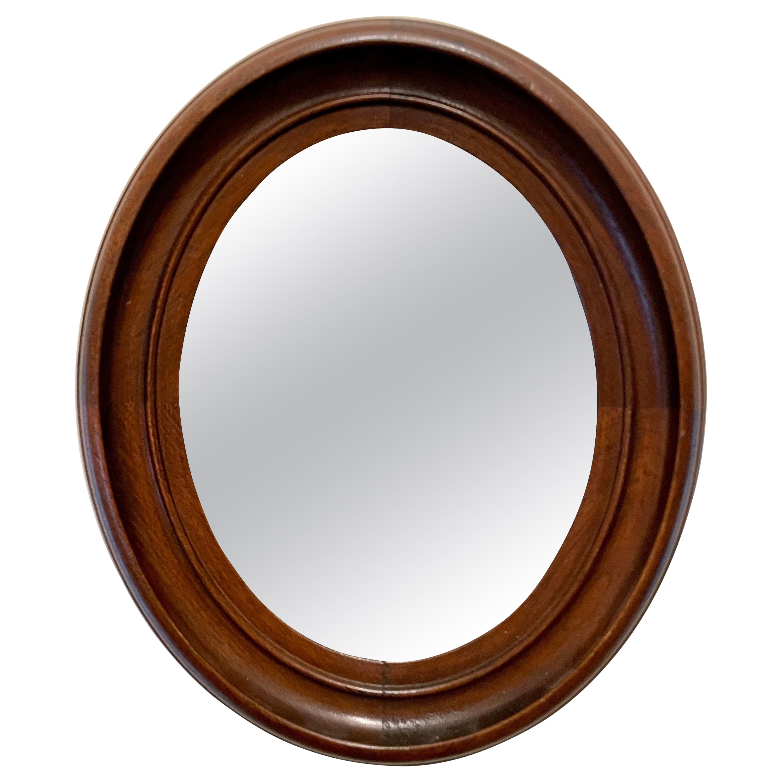 Miroir ovale antique en noyer classique
