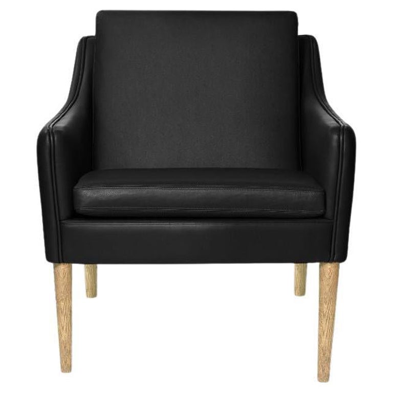 Mr. Olsen Lounge Chair Solid Smoked Oak, Black Leather by Warm Nordic