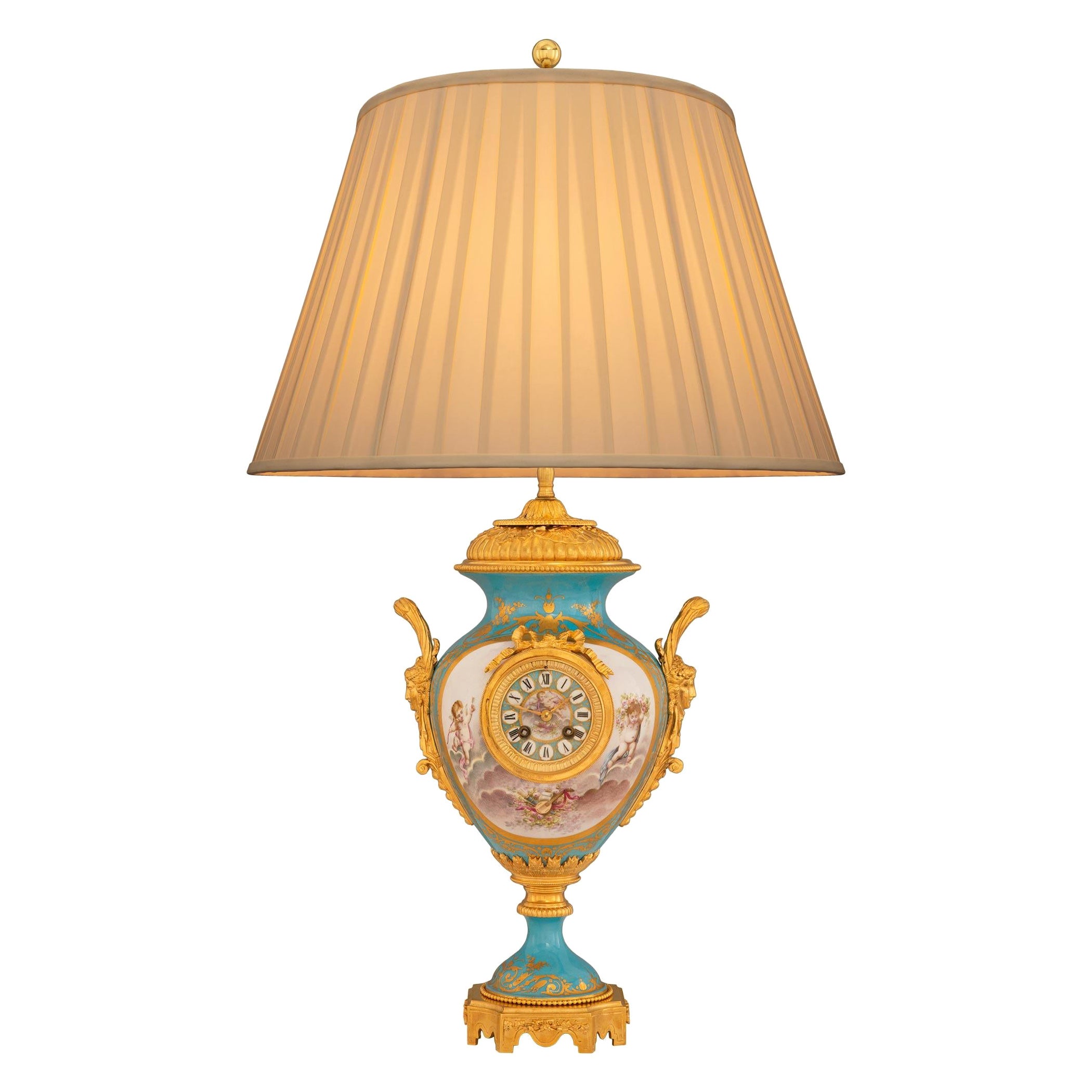 Lampe d'horloge en porcelaine et bronze doré Louis XVI St.