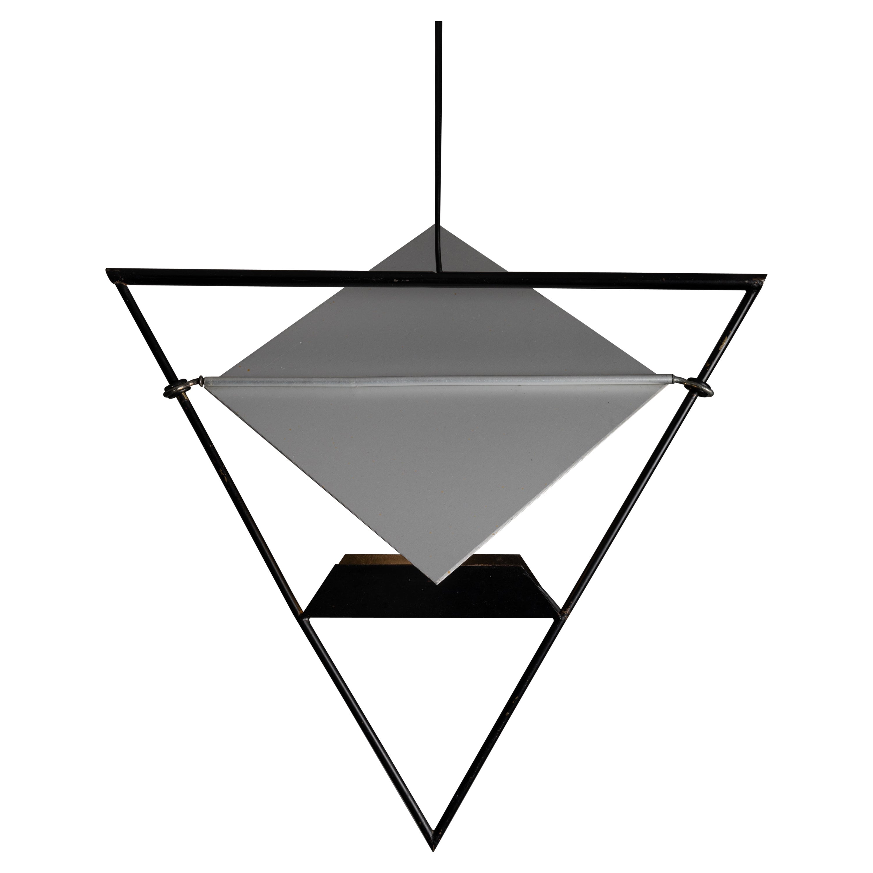 Pendants by Mario Botta for Artemide. Designed and manufactured in Italy, circa 1980. Unique, monochromatic and geometric pendants that feature an anatomical and kinetic flat shade. The frame is made from enameled steel, and is very low weight. Each