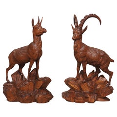 Pair of 19th Century Swiss Black Forest Ibexes in Carved Lindenwood