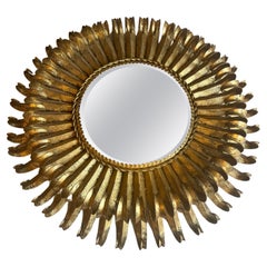 Midcentury Gilt Metal Eyelash Mirror Having a Beveled Mirror