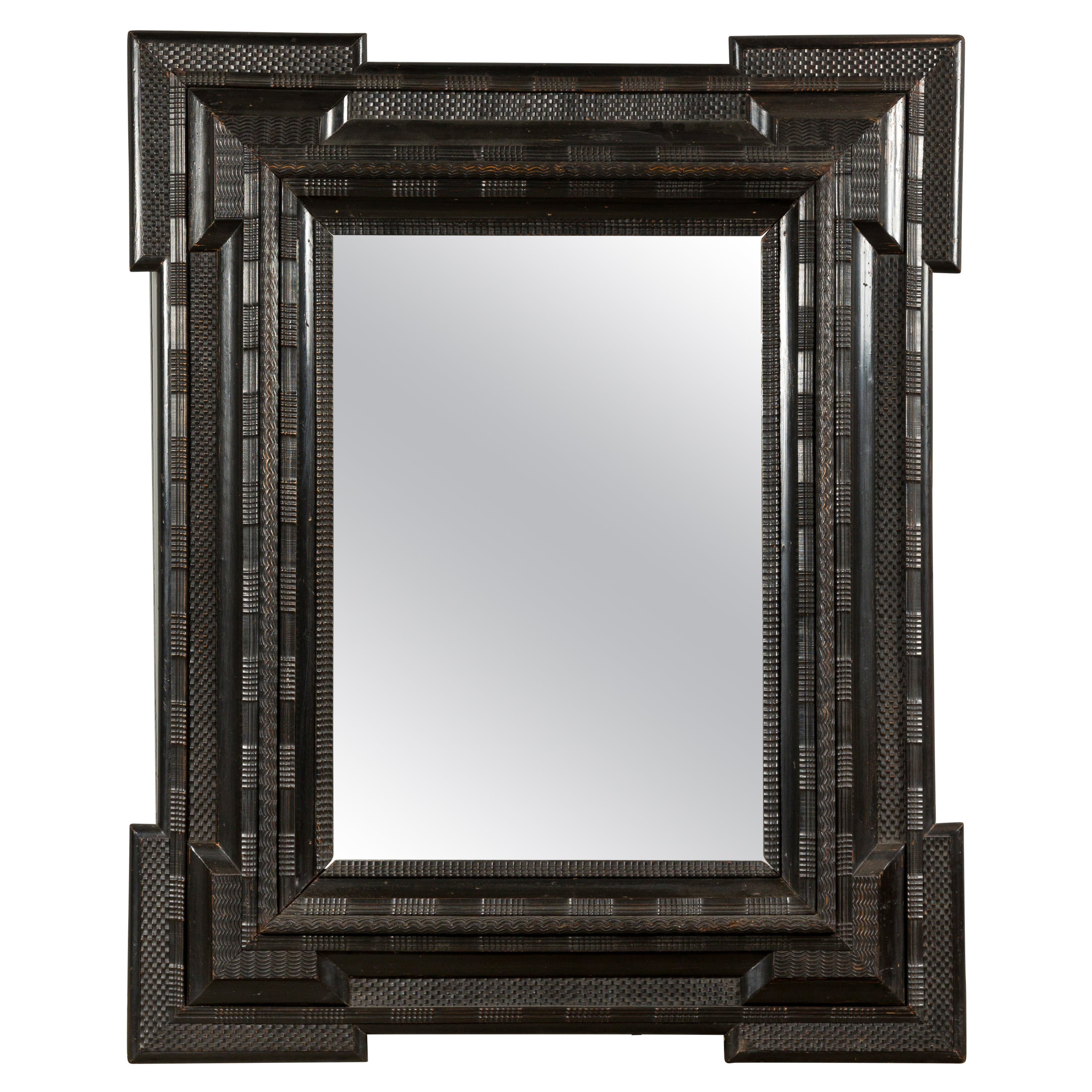 Dutch 18th Century Dark Brown Carved Wooden Mirror with Protruding Corners For Sale