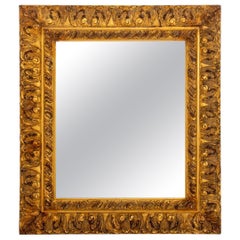 Miroir de cheminée en bois doré sculpté de style néo-baroque