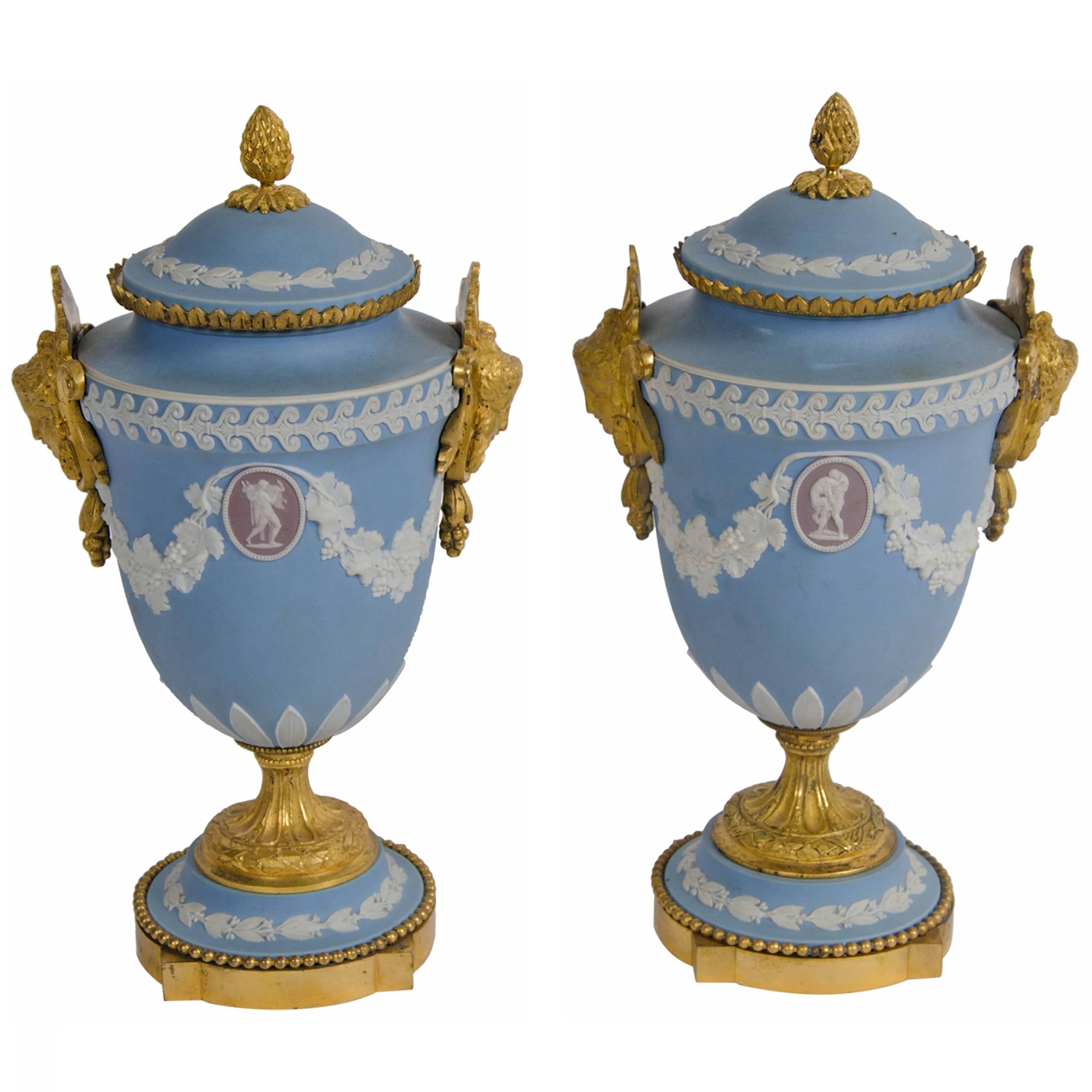 A pair of Wedgewood ormolu mounted Tri-Colour Jasper urns and covers