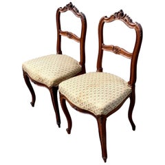 19th Century Intricately Carved Walnut Louis xv Chairs, a Pair
