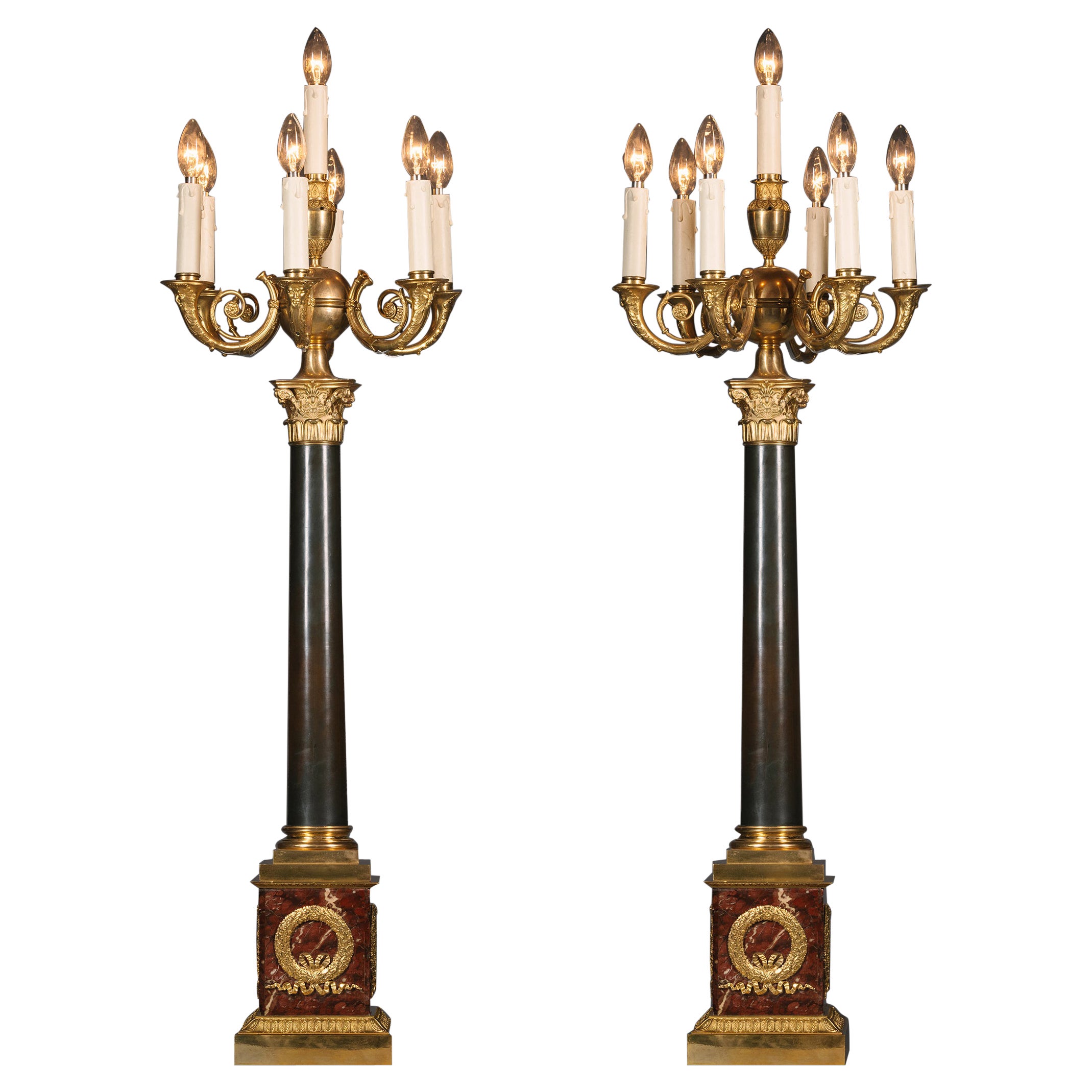 Un par de candelabros de siete luces de estilo Imperio en venta