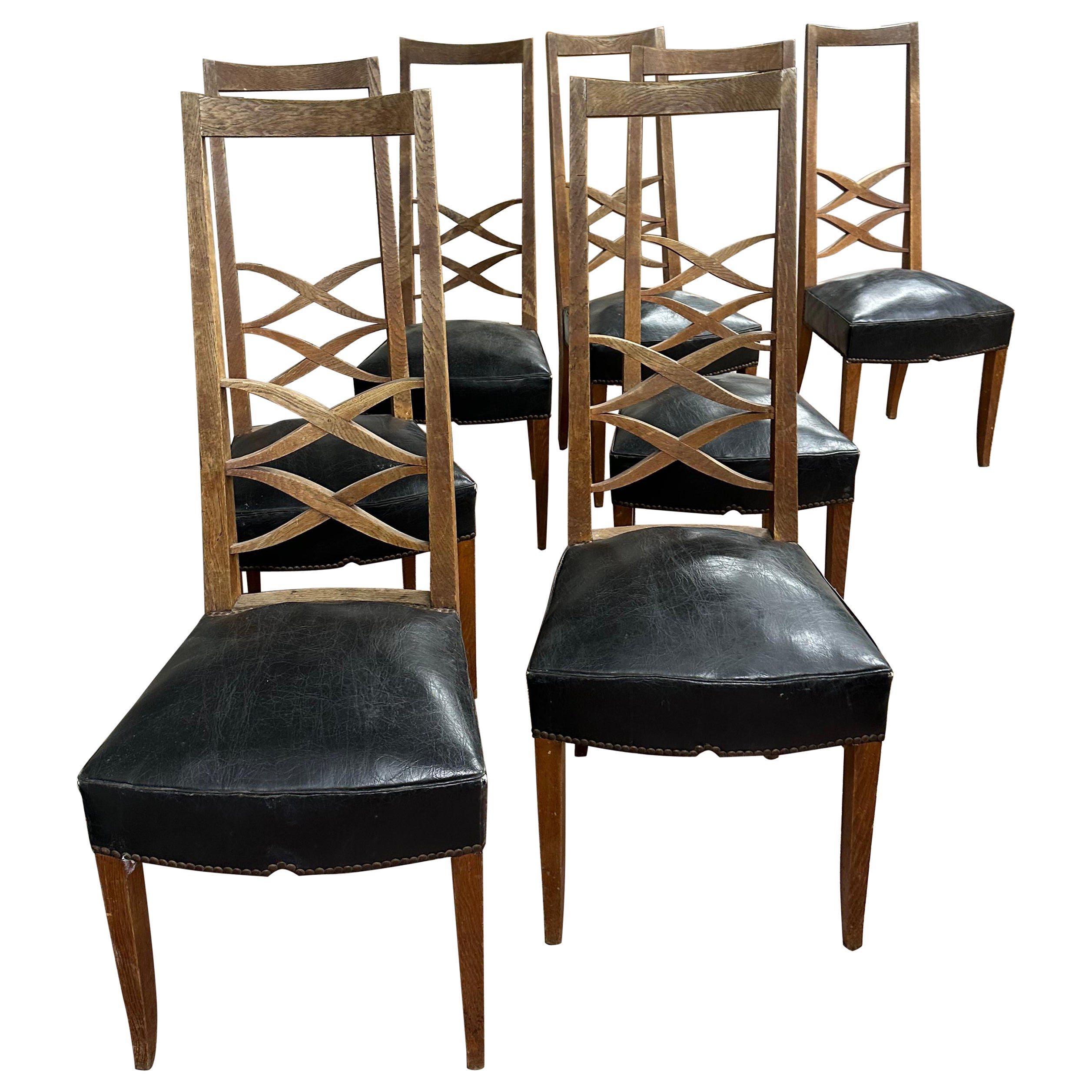 Set of Ten Dining Chairs in Oak in the Style of Maxime Old