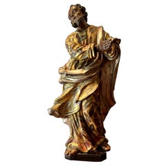 Figure de Saint Jean en bois sculpté, argent doré et polychrome du 17e siècle.