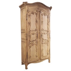 Tall and Narrow Early 1800s Bleached French Armoire in Carved and Pegged Oak