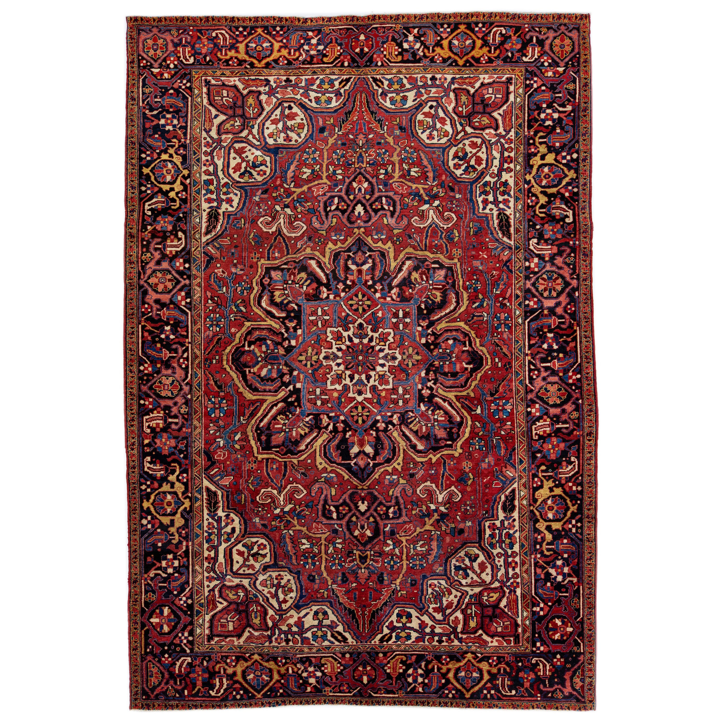 Vintage Red Persian Heriz Handmade Wool Rug with Medallion Motif For Sale