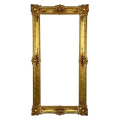 Vergoldete Holzmalerei, Spiegel oder Bilderrahmen, Monumental, geschnitzt
