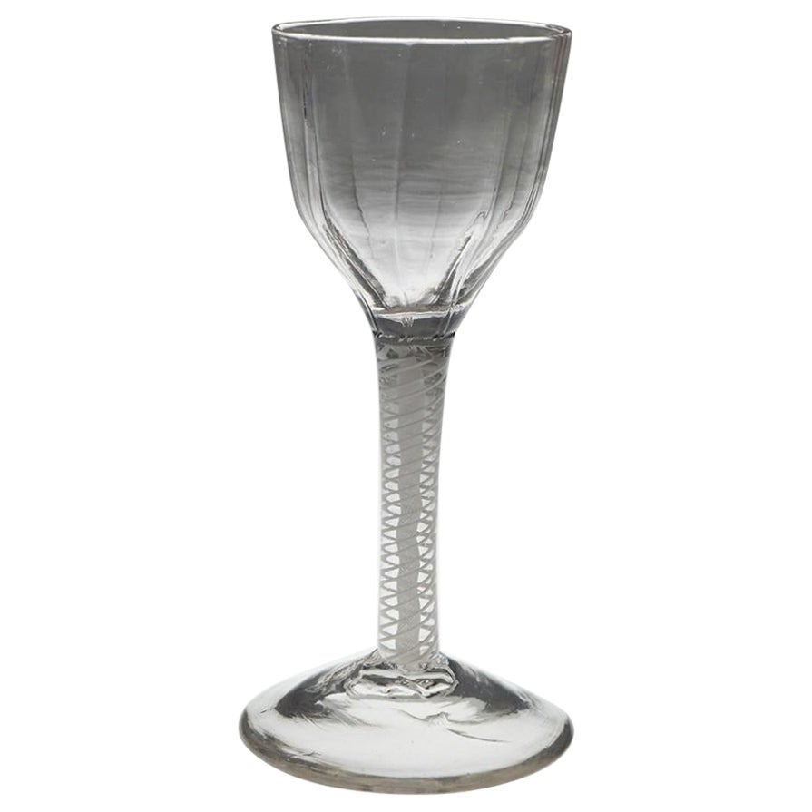 A Rib Moulded Opaque Twist Wine Glass, c1760 For Sale