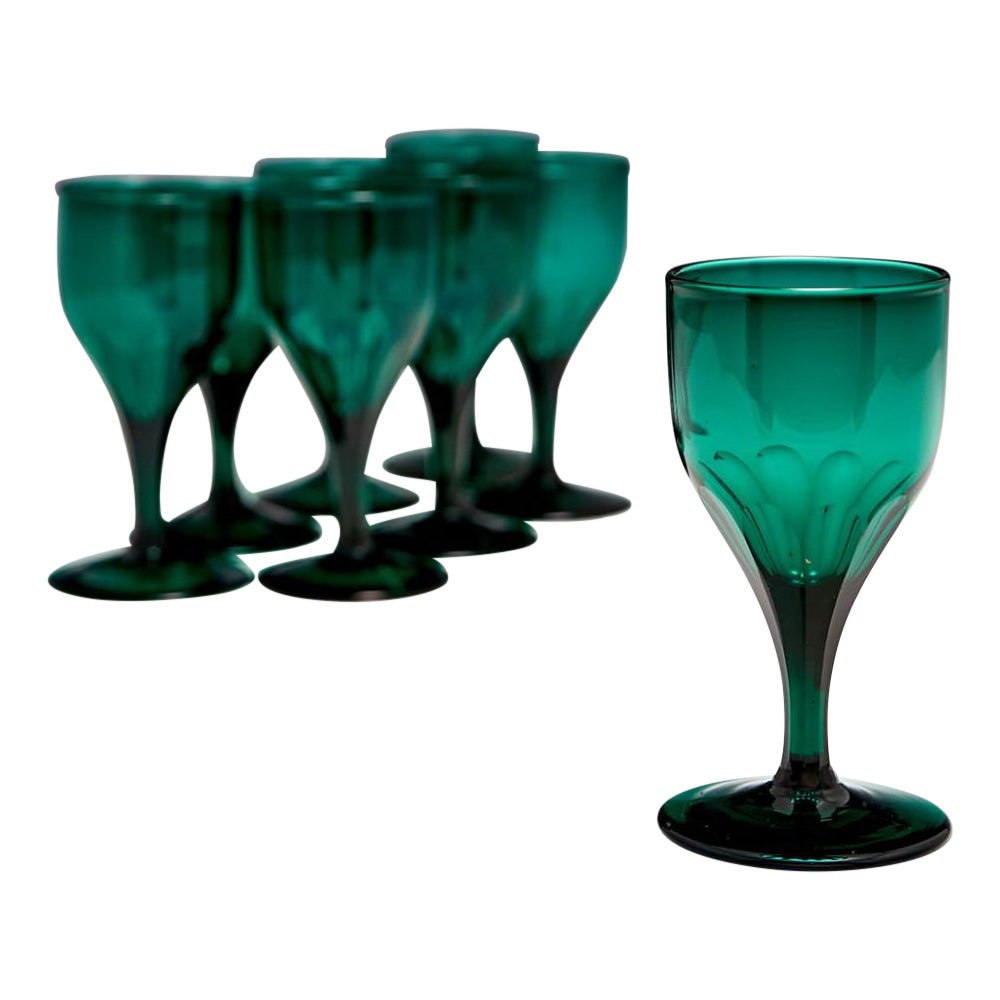 A Set of 8 Slice Cut Green Wine Glasses, 1825-50