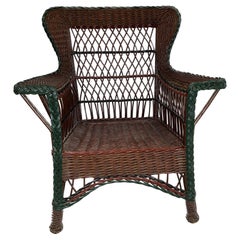 Antique Bar Harbor Style Wicker Wing Chair in Natural Finish with Green Trim