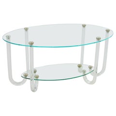 Insolite table de style Hollywood Regency à deux niveaux avec plateau ovale et six pieds en lucite