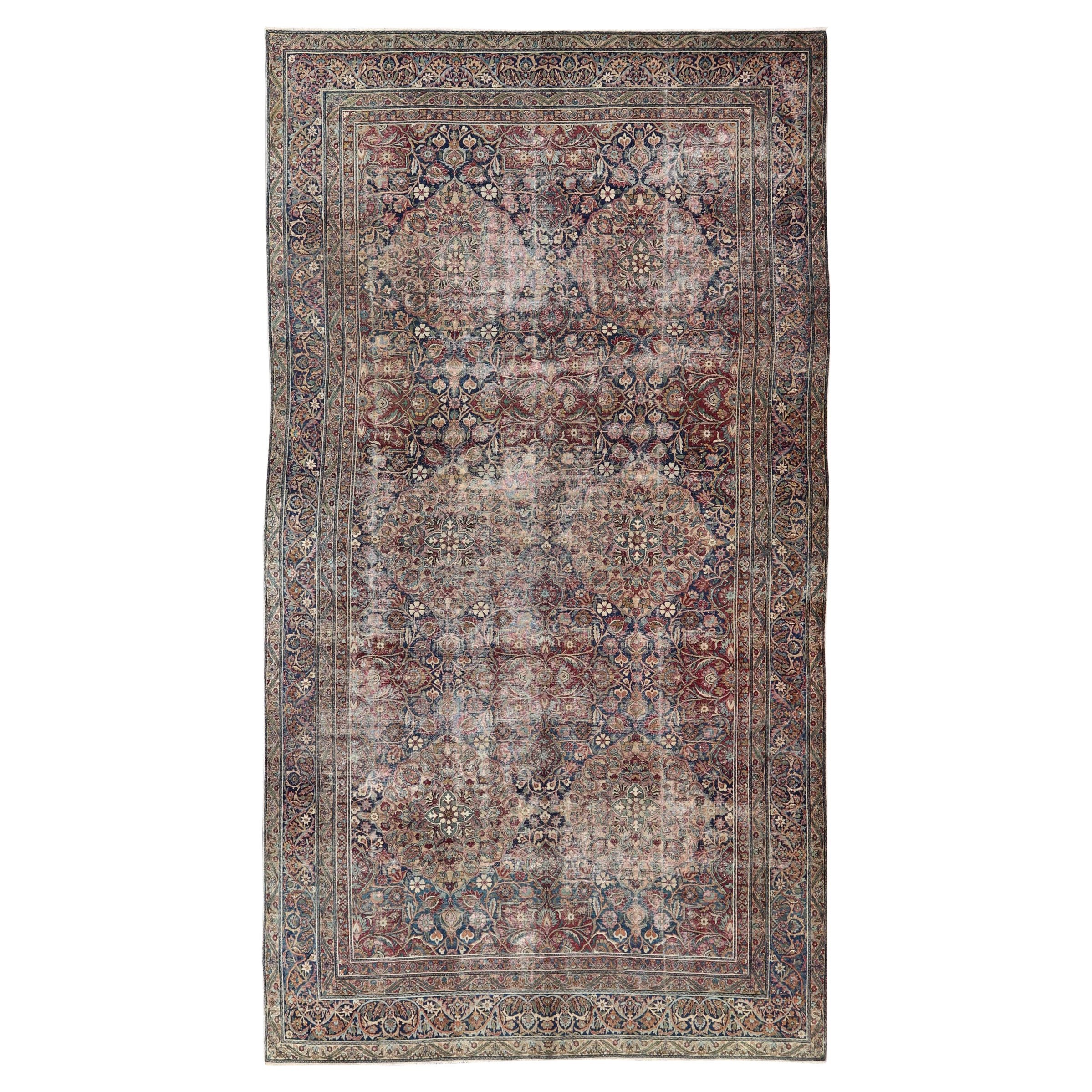 Grand tapis persan ancien Lavar Kerman à motifs floraux sur toute sa surface 