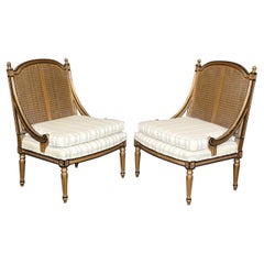 Antique Pair of French Louis XVI Style Black and Gold Cane Back Bergeres, Lounge Chairs