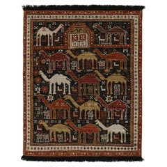 Rug & Kilim’s Tribal Style Rug in Black with Red, Gold-Brown Pictorial Patterns