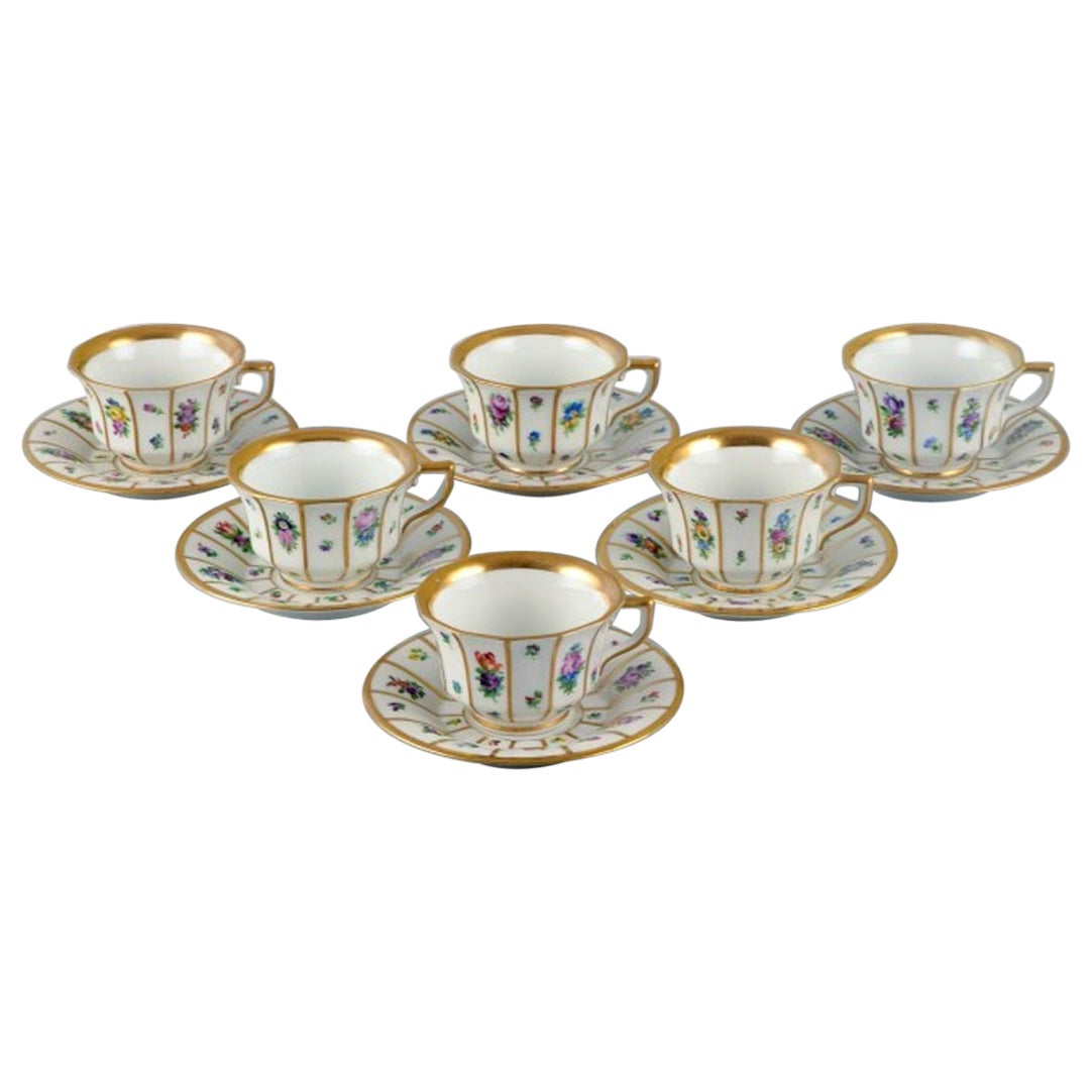 Royal Copenhagen, six Henriette mocha cups and saucers hand-painted with flowers