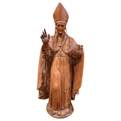 Figura religiosa de obispo de madera tallada colonial española del siglo XIX