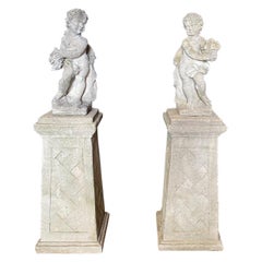 Pair of Stone Garden Sculptures Angels on Bases with Flowers and Fruit 