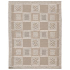 Rug & Kilim è un kilim personalizzato in stile scandinavo in marrone, grigio e bianco.