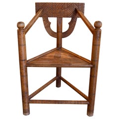 Hand-Carved Wooden Corner Chair with Geometrical Motives