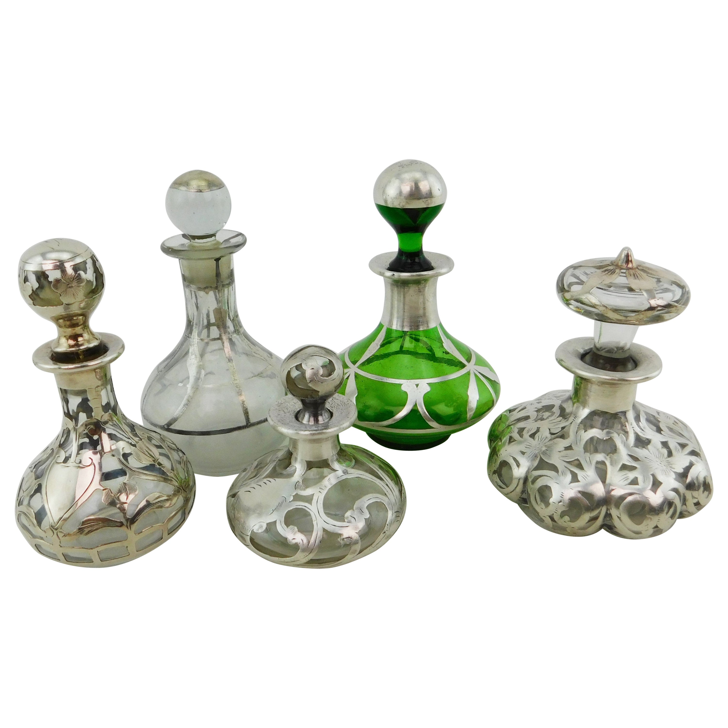 Five Art Nouveau Perfume Bottles circa 1900 Silver Overlay on Glass 19th Century For Sale