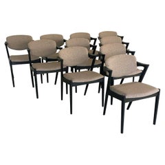 Six chaises de salle à manger Kai Kristiansen restaurées et ébénisées, tapissées sur mesure incluses