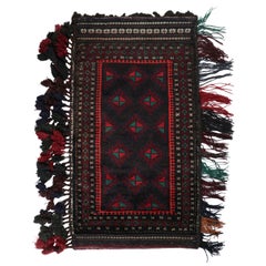Vintage Baluch Persian rug in Black, Red & Green Patterns from Rug & Kilim