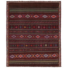 Tapis persan Baluch vintage à motifs polychromes de Rug & Kilim