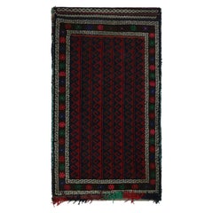 Vintage Baluch Perserteppich mit roten, blauen, weißen und schwarzen Mustern von Rug & Kilim